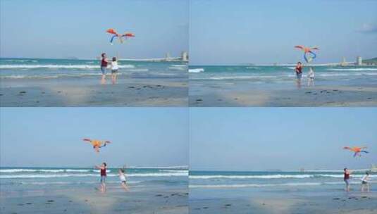 快乐的祖母带着孩子玩风筝，一家人在热带沙滩上奔跑高清在线视频素材下载
