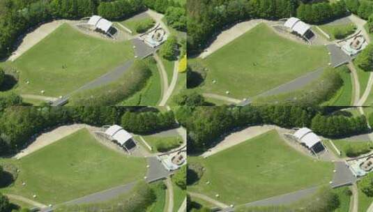 一对遛狗夫妇在英国肯特郡梅德斯通享受Whatman公园的鸟瞰图。米尔的无人机视图高清在线视频素材下载