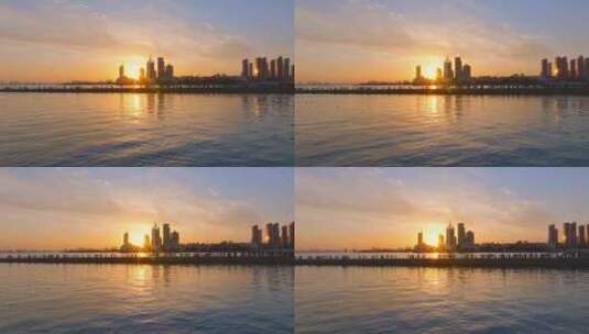 4K航拍青岛栈桥城市夕阳高清在线视频素材下载
