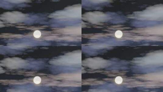 一轮满月透过夜间的云层清晰可见高清在线视频素材下载