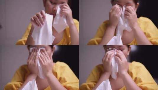 女人拿起一些纸巾擦去眼睛里的泪水，抽泣着高清在线视频素材下载