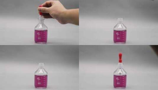 用滴管在滴瓶里吸取粉色溶液高清在线视频素材下载