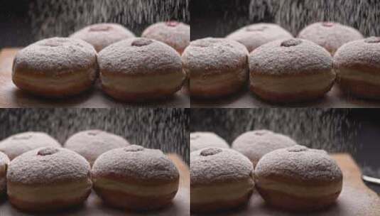 在果冻馅甜甜圈上撒上糖粉高清在线视频素材下载