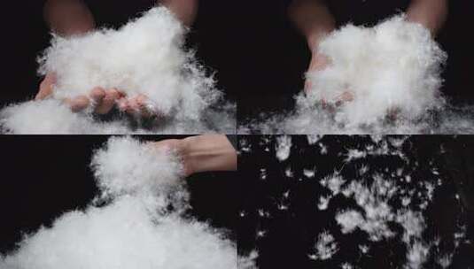 双手握持白色羽绒素材高清在线视频素材下载