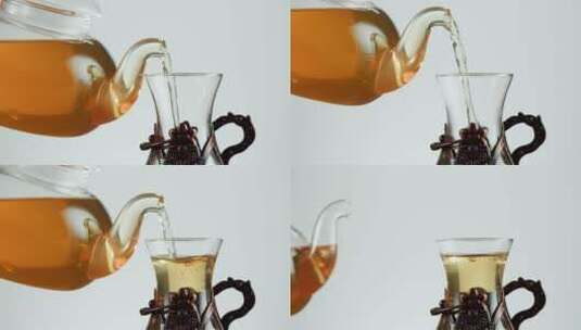 向玻璃杯中倒入柑橘红茶高清在线视频素材下载