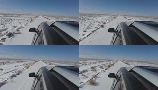 雪后越野车行驶在山脚草原道路高清在线视频素材下载