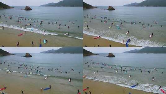 海南省三亚市后海村阴天冲浪航拍高清在线视频素材下载