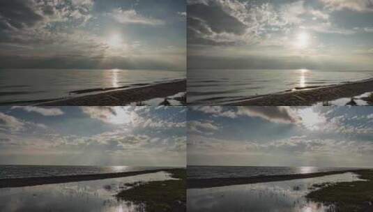 阳光穿过云层照射在波光粼粼的青海湖面上高清在线视频素材下载