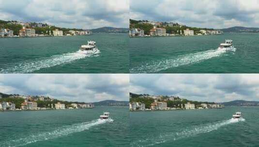 航拍海边房子和船行驶的鸟瞰图高清在线视频素材下载