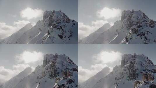 航拍阳光下的雪山日出巍峨山峰山脉山峦高清在线视频素材下载