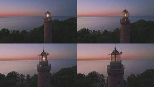 海上日落后发光的灯塔高清在线视频素材下载
