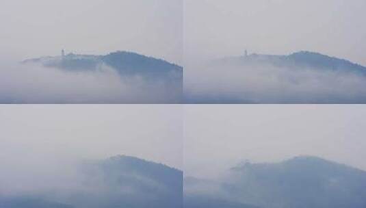 雨后云雾中的山川古塔高清在线视频素材下载