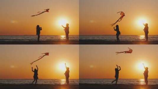 日落时分海边放风筝的祖孙高清在线视频素材下载