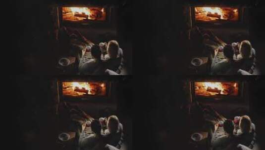 情侣在壁炉旁喝茶放松休息高清在线视频素材下载