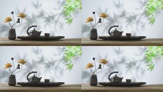 竹叶背景下的荷花摆件与茶具高清在线视频素材下载
