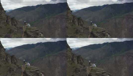 西藏山南市拉康镇一个人站在悬崖高处高清在线视频素材下载