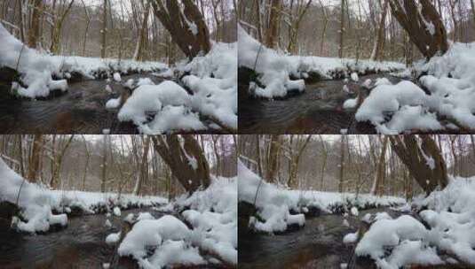 细水涓涓的小溪旁落满白雪高清在线视频素材下载