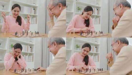 微笑的老年人与美丽的女儿在家里玩象棋游戏高清在线视频素材下载
