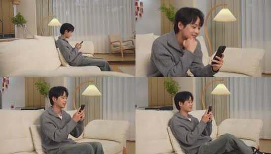 男子休闲居家玩手机高清在线视频素材下载