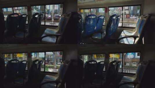 坐在行驶在城市道路上公交车车厢内高清在线视频素材下载