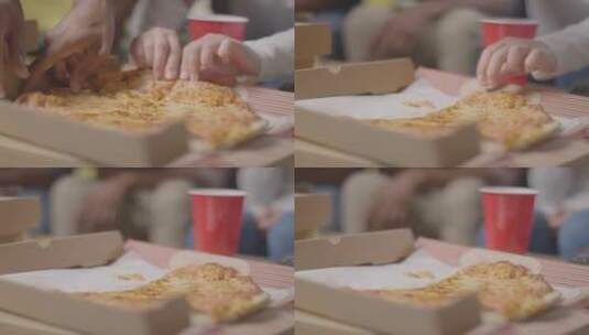 情侣撕开披萨的特写镜头高清在线视频素材下载
