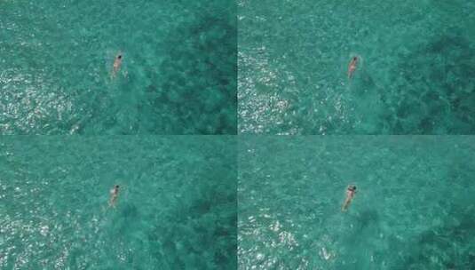 波光粼粼的海面游泳的美女高清在线视频素材下载