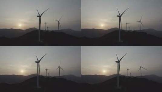 日出航拍风电场太阳穿过风机高清在线视频素材下载
