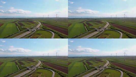 农村的公路交通和风力发电场高清在线视频素材下载