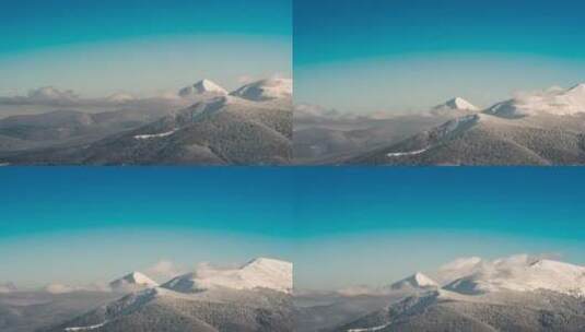 晴朗的蓝天笼罩着美丽的雪山高清在线视频素材下载