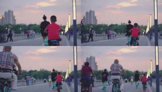 夕阳下公园游客骑自行车高清在线视频素材下载