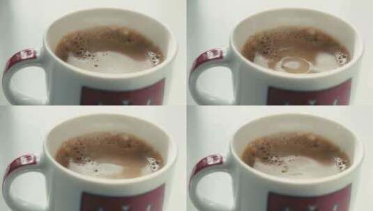 一滴咖啡滴落进咖啡杯慢动作高清在线视频素材下载