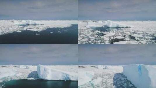 南极洲上空的空中飞行海洋融化的冰和冰山快高清在线视频素材下载
