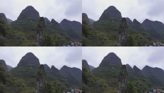 航拍广西阳朔岩壁上的攀岩者高清在线视频素材下载