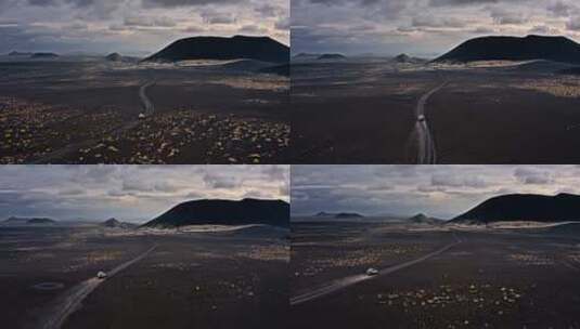 吉普车行驶在火山附近的路上高清在线视频素材下载