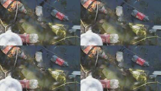 河里脏水里的瓶子和袋子高清在线视频素材下载
