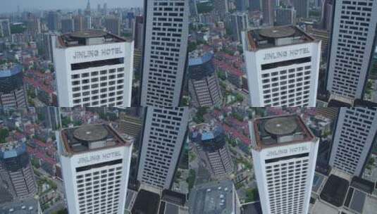 城市航拍南京金陵饭店从顶部俯拍到底部 摇高清在线视频素材下载