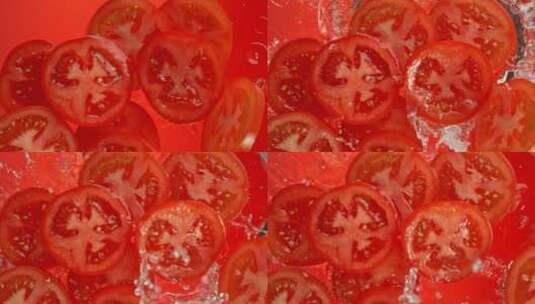 红色背景下番茄片掉进水里的超级慢动作镜头高清在线视频素材下载