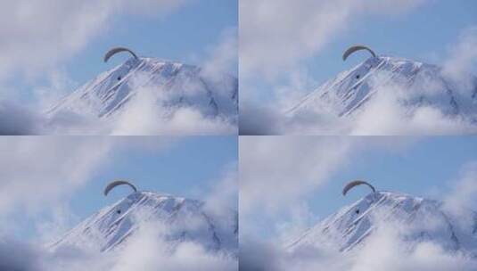 雪山上滑滑翔伞的人高清在线视频素材下载