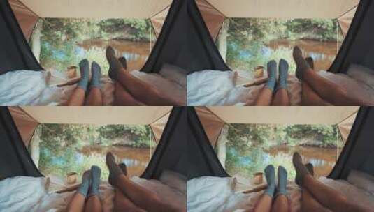 户外旅行山野间帐篷中两个人高清在线视频素材下载