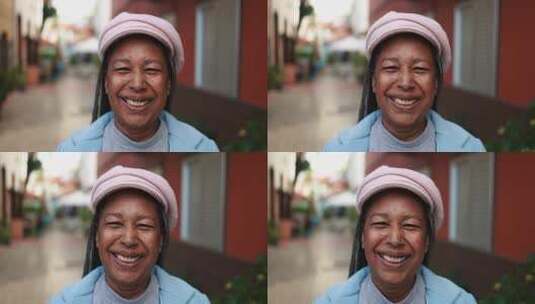 户外摄像机上微笑的资深非洲妇女高清在线视频素材下载