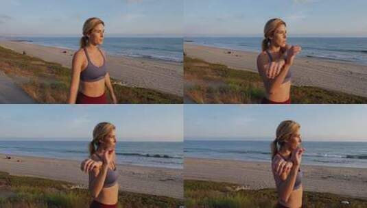 迷人的女人在海滩上锻炼高清在线视频素材下载