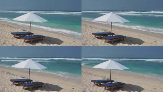 热带沙滩上的沙滩椅和雨伞高清在线视频素材下载