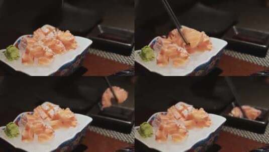 在日本料理店吃三文鱼腩刺身高清在线视频素材下载