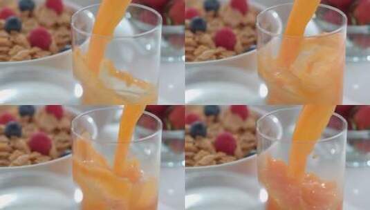 鲜橙汁被倒进一个杯子里高清在线视频素材下载