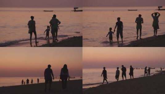 唯美海边日出日落散步的夫妻情侣游客高清在线视频素材下载