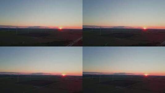 乡村美丽夕阳下的风车涡轮发电机高清在线视频素材下载