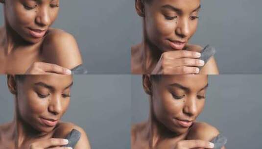 黑人女性用木炭进行皮肤、磨砂膏和身体护理，用于发光、美容和去角质高清在线视频素材下载