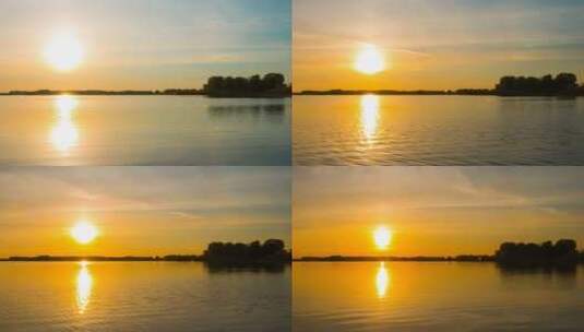 阳光和橙色云彩在河上的彩色日落高清在线视频素材下载