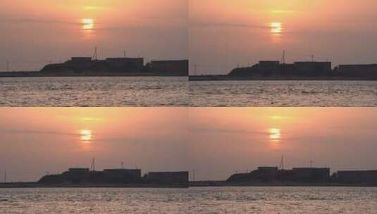 威海双岛湾小岛的落日黄昏渔船海面高清在线视频素材下载
