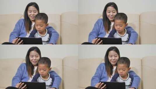 中国女士小朋友居家看书看手机看平板学习高清在线视频素材下载